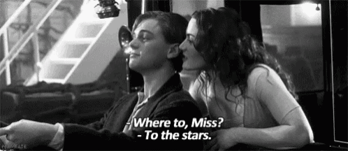a man and a woman are sitting next to each other and the woman is saying where to miss - to the stars .