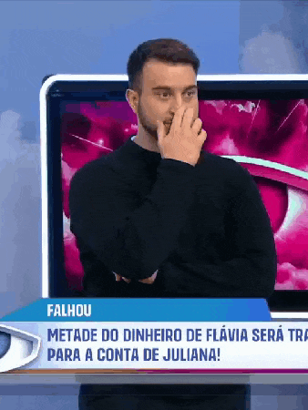 a man covering his nose in front of a tv screen that says falhou on it
