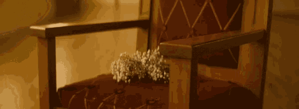 a chair with baby 's breath flowers on it