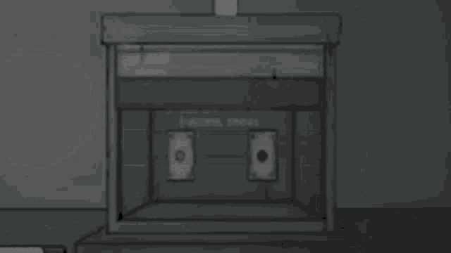 a black and white drawing of a garage door with a brick wall behind it .