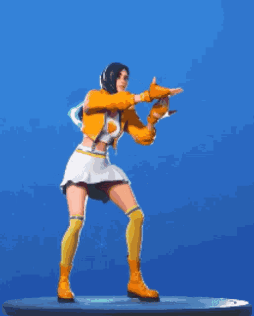a woman in a yellow jacket and white skirt is standing on a blue surface with her arms in the air .