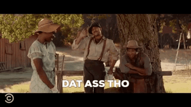 a man in a cowboy hat says " dat ass tho " in front of a group of people