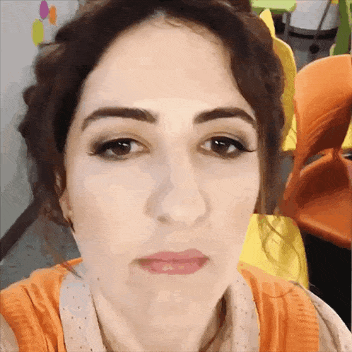 a close up of a woman 's face with her eyes closed