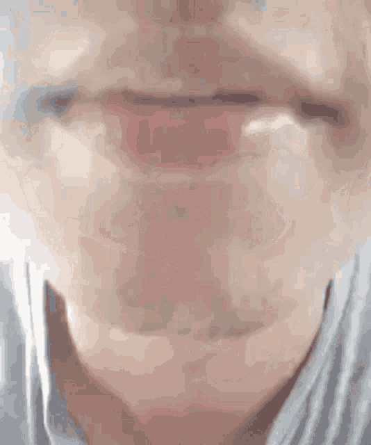 a close up of a man 's mouth with his tongue out