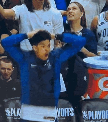 a man in a blue sweatshirt with the word voffs on the back