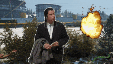 a man in a suit stands in front of a snake and an explosion