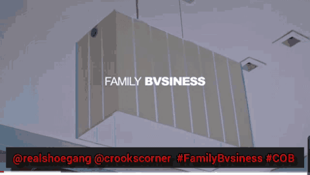a sign that says family business is hanging from the ceiling