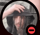 a man with dreadlocks wearing a black hat and a hood