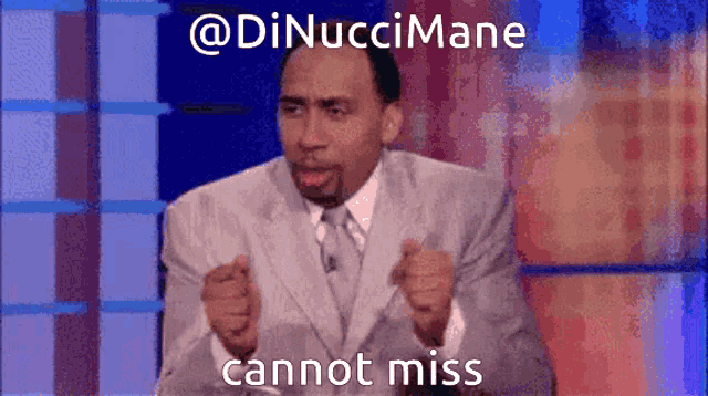 a man in a suit and tie is pointing at the camera with the caption " cannot miss " above him