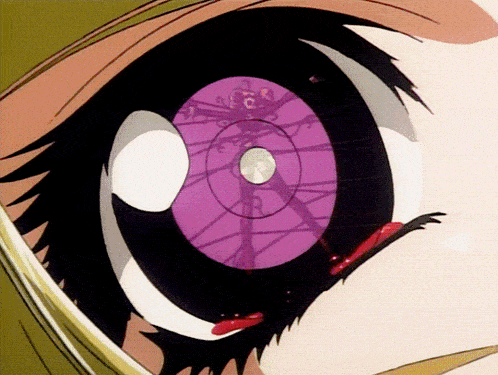 a close up of a girl 's eye with a purple circle in the center