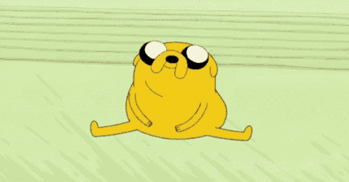 a cartoon character from adventure time is sitting on the ground .