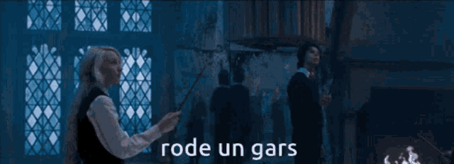 a woman is holding a wand with the words rode un gars written on the bottom