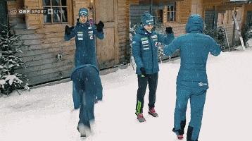 a group of people standing in the snow with the words hd orf sport live on the bottom left