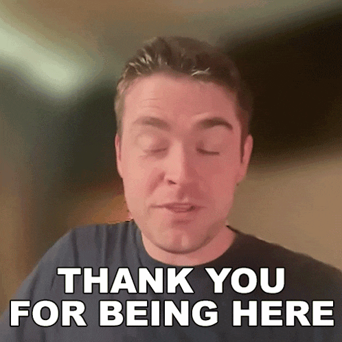 a man is saying thank you for being here with his eyes closed