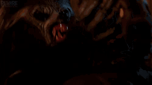 a close up of a person 's face in a dark room with the words beware on the bottom