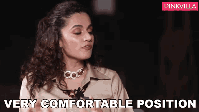 a woman wearing a necklace is talking and says very comfortable position .