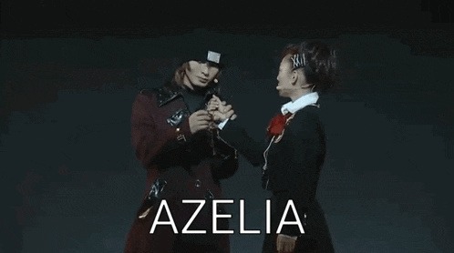 a man and a woman are standing next to each other on a stage with the word azelia written on the bottom .
