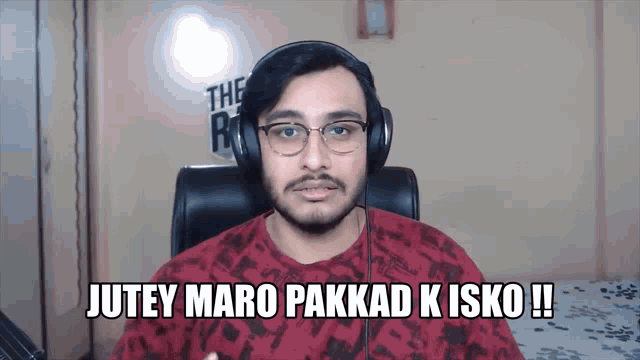 a man wearing headphones says jutey maro pakkad kisko