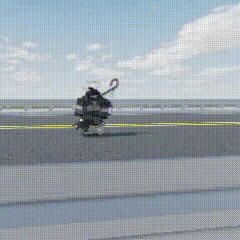 a person is riding a skateboard on a beach with an umbrella