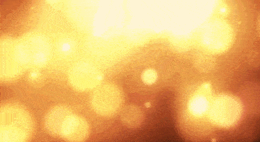 a blurred image of a yellow background with a lot of lights coming out of it .