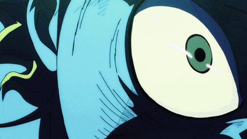 a close up of a cartoon character 's eye with a green pupil