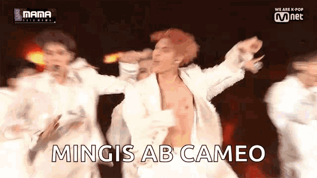 a group of men are dancing on a stage with the words mingis ab cameo written on the screen