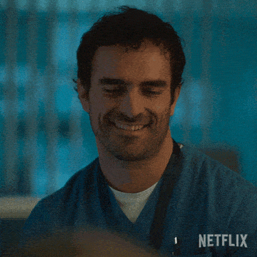 a man in scrubs is smiling with the words pobrecito netflix behind him