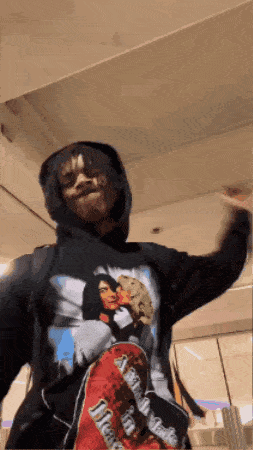 a person wearing a hoodie with a picture of a girl on it