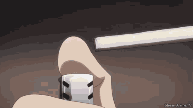 a person is lighting a cigarette with a streamanime.tv logo in the lower right corner
