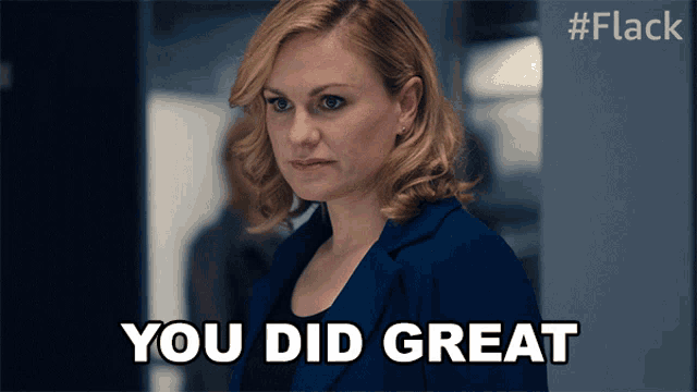 a woman in a blue suit says you did great in white letters