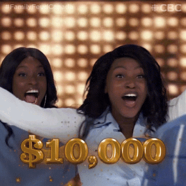 two women are celebrating with their arms in the air and a $ 10,000 sign behind them