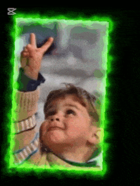 a picture of a child in a green frame with the letter x on the bottom