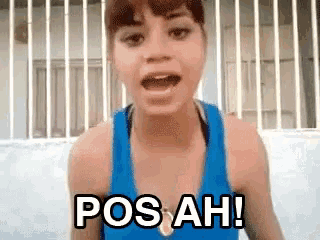 a woman in a blue tank top says pos ah !