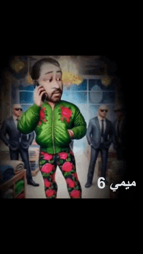 a man in a green jacket is talking on a cell phone while a man in a suit stands behind him