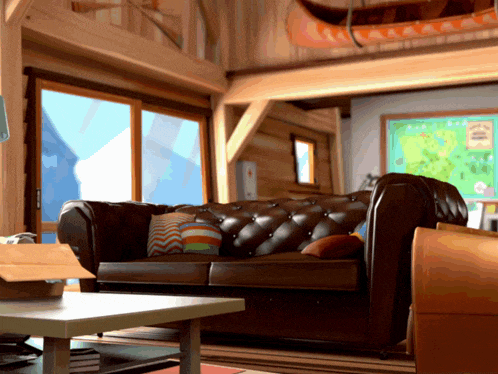 a living room with a couch and a table with a map on the wall