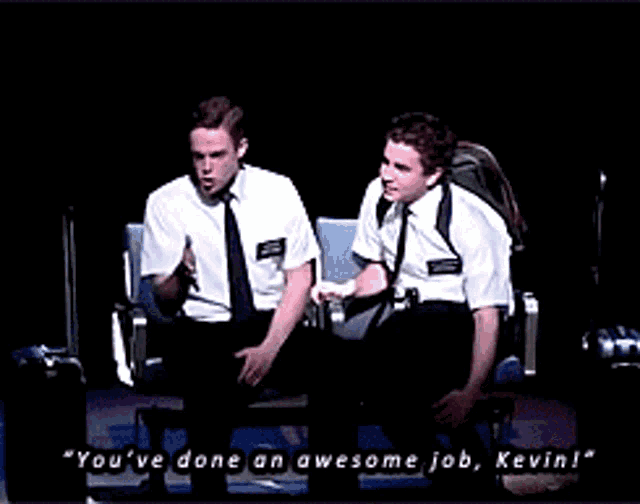 two men are sitting next to each other and one of them is saying " you 've done an awesome job kevin ! "