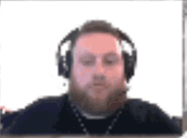 a blurry picture of a man with headphones on