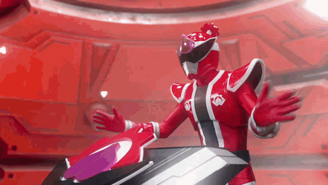 a red power ranger is standing on a motorcycle with his arms outstretched