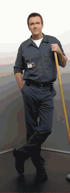 a man in a blue uniform has a name tag on his shirt that says ' chris ' on it