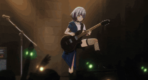 a girl is playing a guitar in front of a crowd