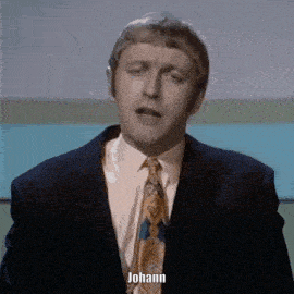 a man in a suit and tie says johann in front of a blue background
