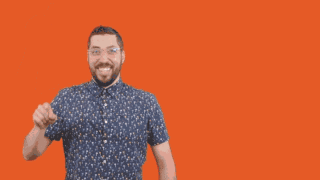 a man holds up his finger in front of an orange background that says " bad idea "
