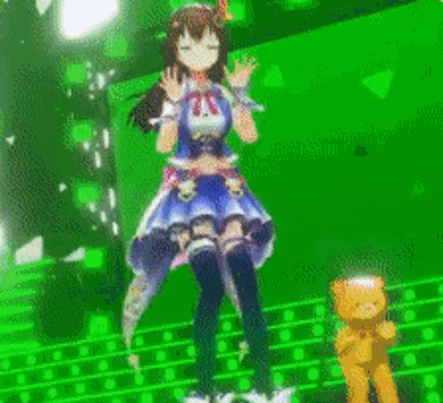 a girl in a blue dress is standing next to a teddy bear on a stage .