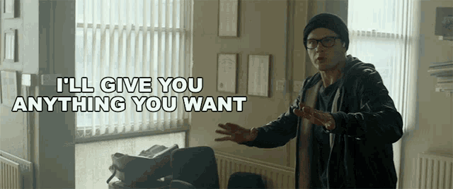 a man wearing glasses and a black hat says i 'll give you anything you want