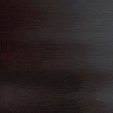 a blurred image of a hallway with a red wall in the background