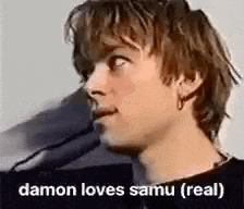 a close up of a man 's face with the words `` damon loves samu ( real ) '' written on the bottom .