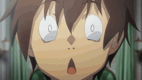 a close up of a person 's face with a surprised look on it