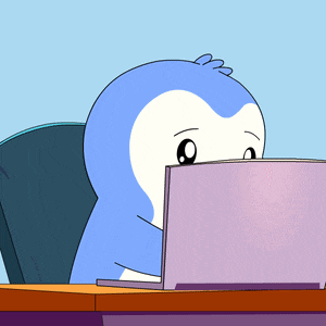 a cartoon penguin is using a laptop computer