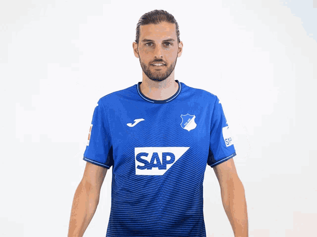 a man wearing a blue shirt that says sap