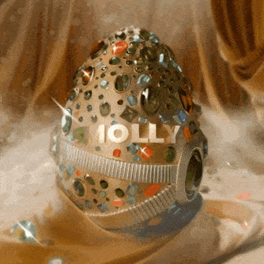 a painting of a jeweled egg with the name molly on it